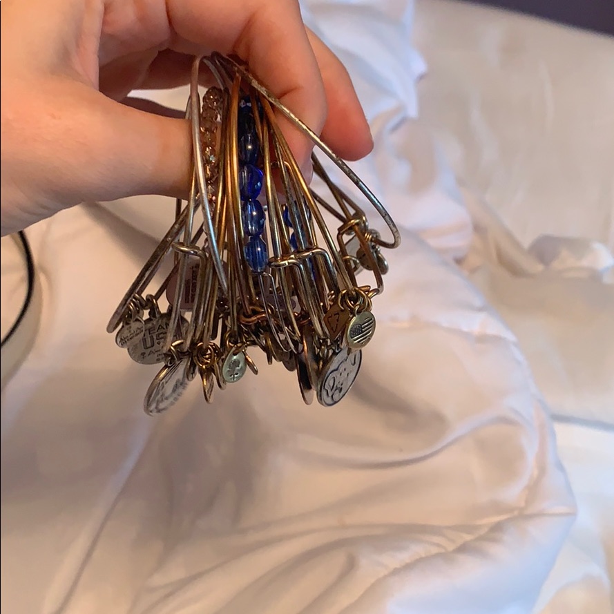 A Bunch Of Alex And Ani Bracelets.